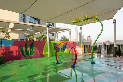 a pool with colorful decorations on the water at StayShort - Elegant 2 BR in Business Bay with Amazing Views that sleeps 5 in Dubai