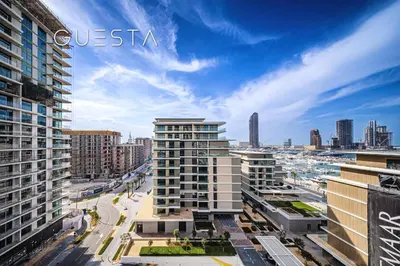 an aerial view of a city with tall buildings at Seagate by Emaar, Mina Rashed Marina, Dubai in Dubai