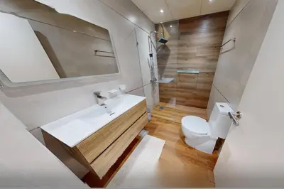 a bathroom with a white sink and a toilet at Modern 2-Bedroom Apartment with JBR and Marina view on High floor in Dubai
