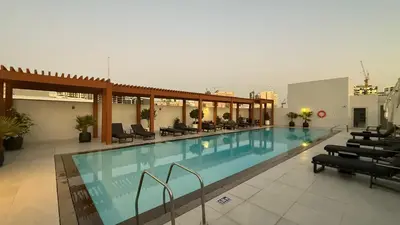 a large swimming pool in a large building at Restay Homes at Luma22 West Tower in Dubai