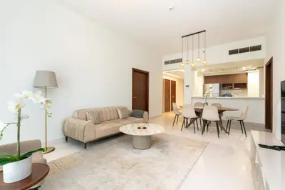 a living room with a couch and a table at CitiHome - Spacious 2BR - Park Gate Residences in Dubai