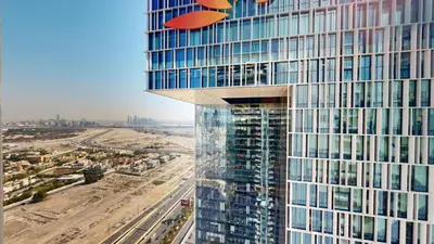 a tall skyscraper with a view of a city at Vacationer l Vida T2 1 Bedroom l Direct Access to Dubai Mall in Dubai