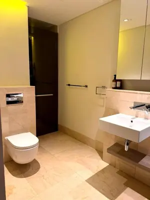 a bathroom with a toilet and a sink at Beachfront comfort your private escape at Palm jumeriah th8 residences in Dubai