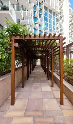 a walkway in the middle of a building at Modern Deluxe Studio in Dubai in Dubai