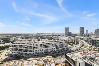 an aerial view of a large white building in a city at BLVD Modern Stay in Jewelz -Balcony Pool & Gym in Dubai