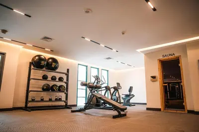 a fitness room with a gym with a treadmill at 1BDR Large Living Room Nearby Metro in Dubai