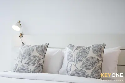 a bed with two pillows on top of it at Spectacular Marina Views Luxurious Two Bedroom in Dubai