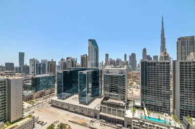an aerial view of a city with tall buildings at Modern 2BR I DAMAC Reva Residences I Canal Views in Dubai