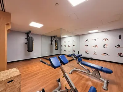 a gym with cardio equipment in a room at GuestReady - 3BR | Luxury High-Rise Escape in Dubai