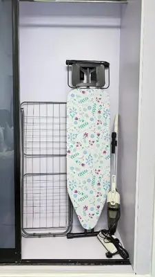a tie is hanging on a rack in a drawer at 1 Bedroom centrally located with large balcony in Dubai