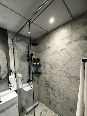 a bathroom with a shower and a sink at Modern Studio in Opalz - Ideal for Work & Leisure in Dubai