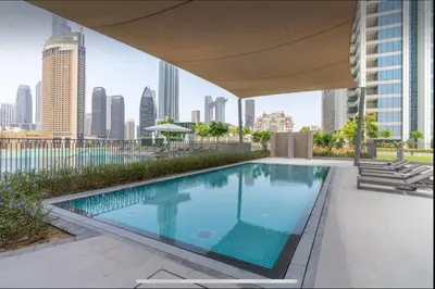a swimming pool on the roof of a building at Luxury Apartments Near Burj Khalifa in Downtown in Dubai