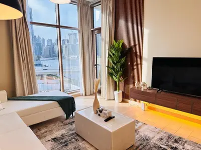 a large living room with a large window at Celestial 2BR with Burj Khalifa View in Dubai