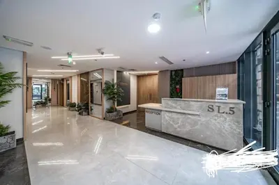a lobby with a reception desk in a building at An elegant sanctuary in Dubai