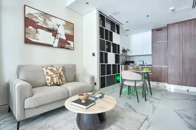 a living room with a couch and a table at Frank Porter - J One Tower in Dubai