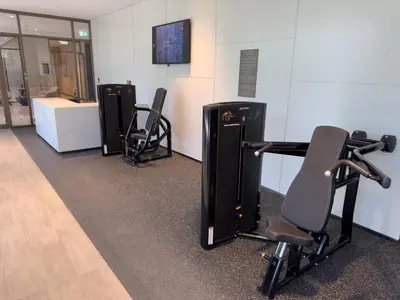a room with three exercise bikes and a desk at GRANDE SIGNATURE RESIDENCES direct Burj Khalifa view and Private Fountain Show at high floor with DXB AIRPORT VIP Shuttle option in Dubai