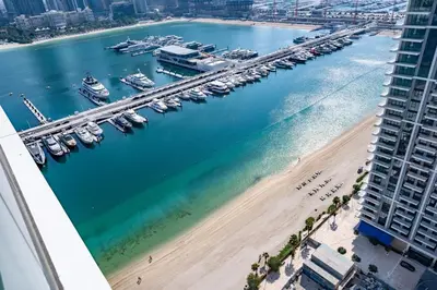 an aerial view of a marina with boats in the water at Luxury Sea View 1BR l Palace Beach Residence in Dubai