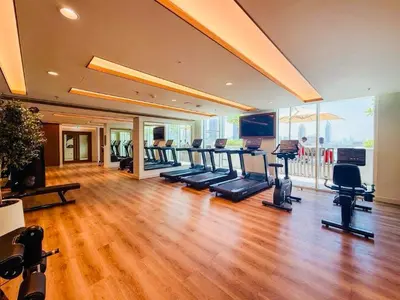 a gym with a bunch of exercise equipment in a room at Luxury Sea View 1BR l Palace Beach Residence in Dubai