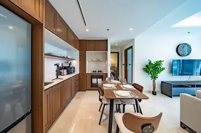 a dining room and kitchen with a table and chairs at Luxury Sea View 1BR l Palace Beach Residence in Dubai