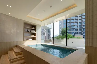 a swimming pool in a room with a large window at Exclusive 1BR W Private Pool Binghatti Royale in Dubai