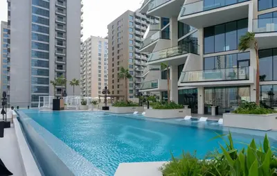 a swimming pool in a building with tall buildings at Exclusive 1BR W Private Pool Binghatti Royale in Dubai