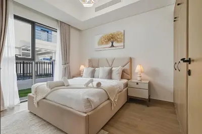 a bedroom with a large bed and a window at Five-Bedroom plus maid's room villa with Multiple En-Suites Sunset Roof Terraces & Exceptional Space in Dubai