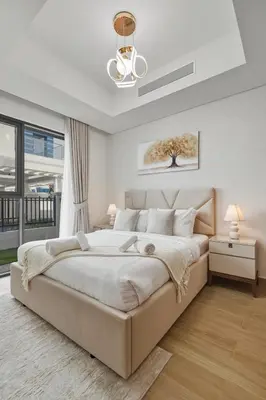 a white bedroom with a large bed and a window at Five-Bedroom plus maid's room villa with Multiple En-Suites Sunset Roof Terraces & Exceptional Space in Dubai