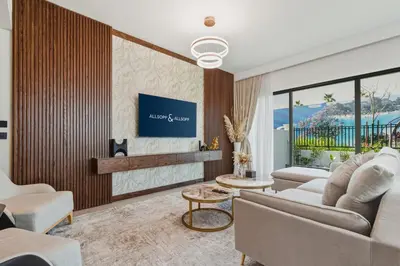 a living room with a couch and a tv at Five-Bedroom plus maid's room villa with Multiple En-Suites Sunset Roof Terraces & Exceptional Space in Dubai