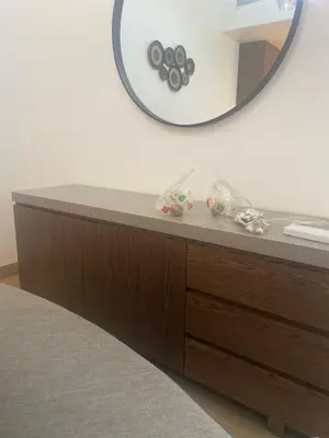 a mirror on top of a dresser in a room at La Cote, free Beach access in Dubai