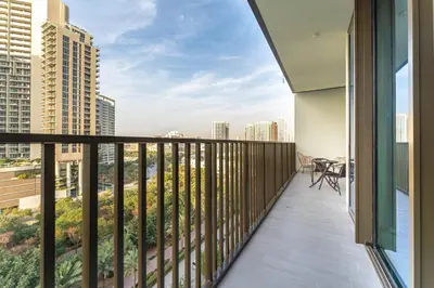 a balcony with a view of the city at HAVN - 1 bed in Luma Parks, JVC in Dubai