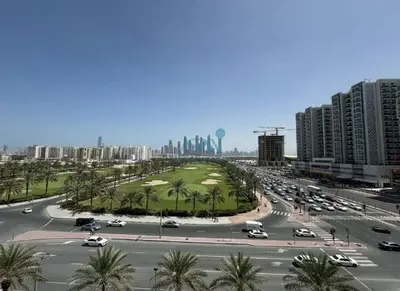a busy city street with cars on a road at Modern 1BHK Equiti Arcade- Al Furjan -Near Metro in Dubai