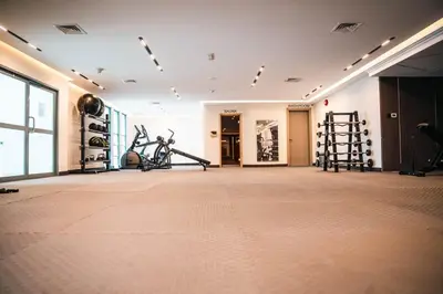 a gym with treadmills and exercise equipment in a building at 1 Bedroom Centrally located near the Metro in Dubai