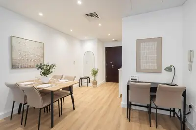 a dining room with a table and chairs at Modern 1BHK Jewels Tower, Dubai Marina by Czechin in Dubai