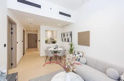 a living room with a couch and a table at VayK - Chic 1BR Urban Getaway in Dubai
