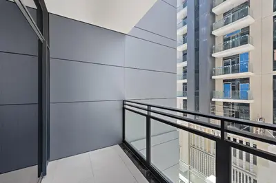 a balcony with a view of a building at VayK - Ideal Studio in Sobha Hartland in Dubai