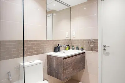 a bathroom with a sink and a shower at VayK - Inviting 1BR in Dubai Marina with Stunning Views in Dubai