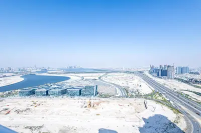 an aerial view of a construction site with a city at Superhost - 1BR , Pool & Gym , DAMAC Towers Paramount in Dubai