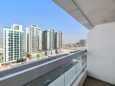 a view of a city from the balcony of a building at Trendy Luxe Studio In Al Furjan close to Metro-17 in Dubai
