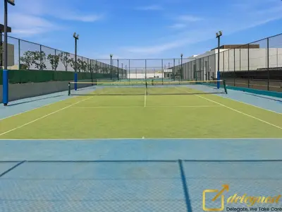 a tennis court with two tennis courts at Contemporary 3-Bedroom Villa by Deleguest in Dubai