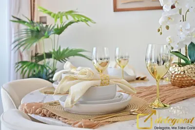 a dining room table with wine glasses and a table cloth at Contemporary 3-Bedroom Villa by Deleguest in Dubai