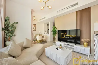 a living room with a couch and a tv at Contemporary 3-Bedroom Villa by Deleguest in Dubai