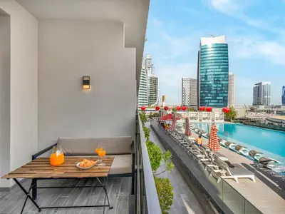 a balcony with a table and a view of the city at Cozy Studio with Balcony I Near Dubai Mall & Downtown in Dubai