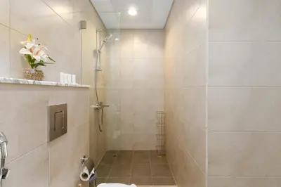 a bathroom with a shower and a toilet at Aykon City Tower C, Business Bay - Onelink in Dubai