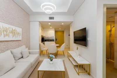 a living room with a white couch and a table at Aykon City Tower C, Business Bay - Onelink in Dubai