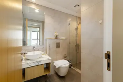 a bathroom with a toilet and a sink and a shower at Aykon City Tower C, Business Bay - Onelink in Dubai