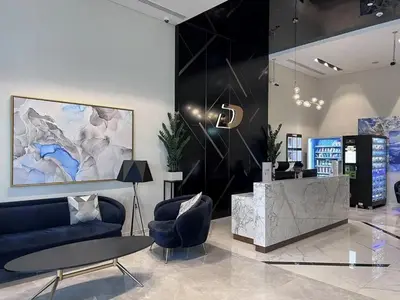 a lobby with a couch and chairs and a table at Luxurious 1 BDR Zada Tower Business Bay 12 in Dubai