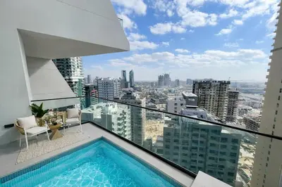 a balcony with a swimming pool on top of a building at Platinum 1BR W Private Pool Binghatti Royale in Dubai