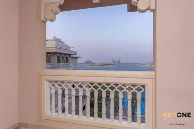 a window with a view of a building at Spacious Beachfront 2BR with Maids Room in Grandeur in Dubai