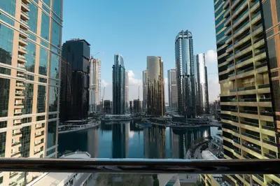 a view of a city with a river and buildings at Escape 24 Spacious 1BR Lake View, Global Lake View, JLT in Dubai