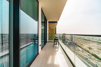 a view from the balcony of a building with a pool at SettlerHomes - JVC Skyline Views - Pool & Gym in Dubai